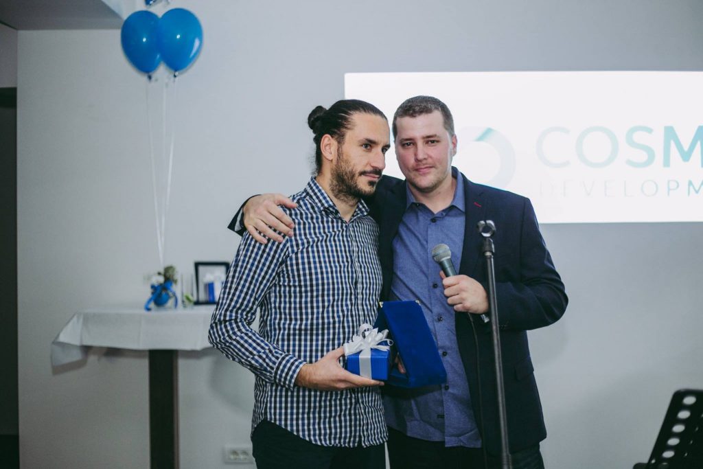 Atanas receives an award for working with Cosmic