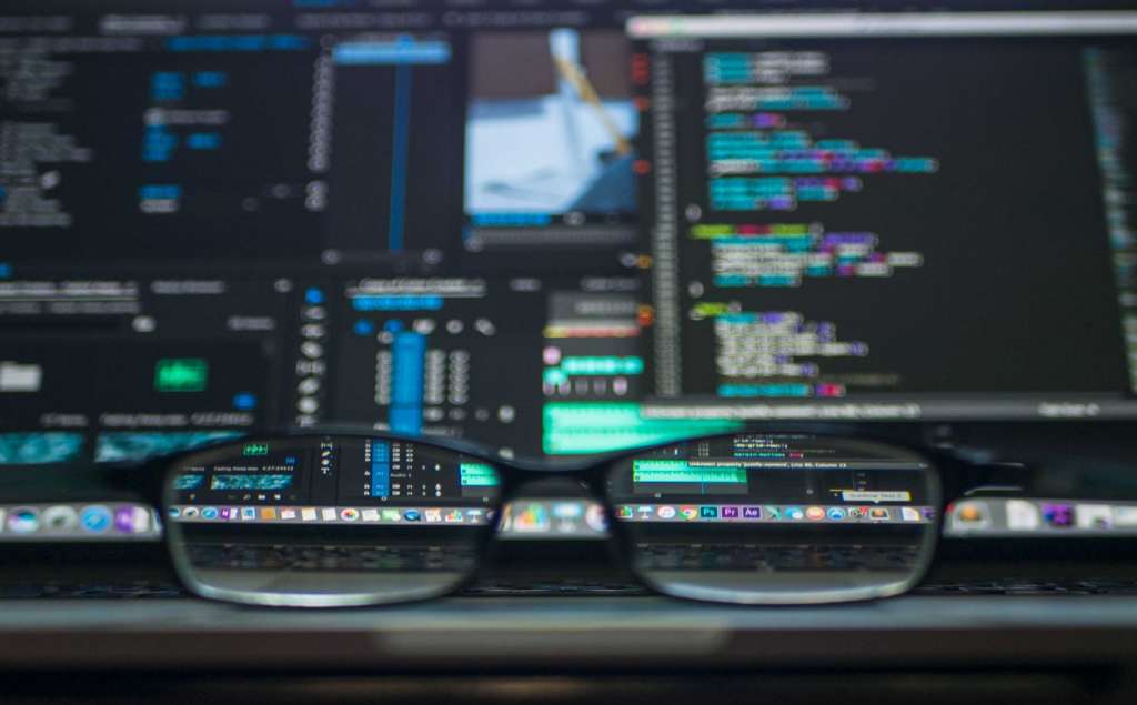 Web development trends shown through coding on a laptop