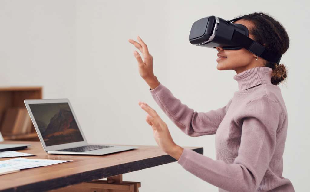 A girl trying out Virtual Reality as one of the web development trends