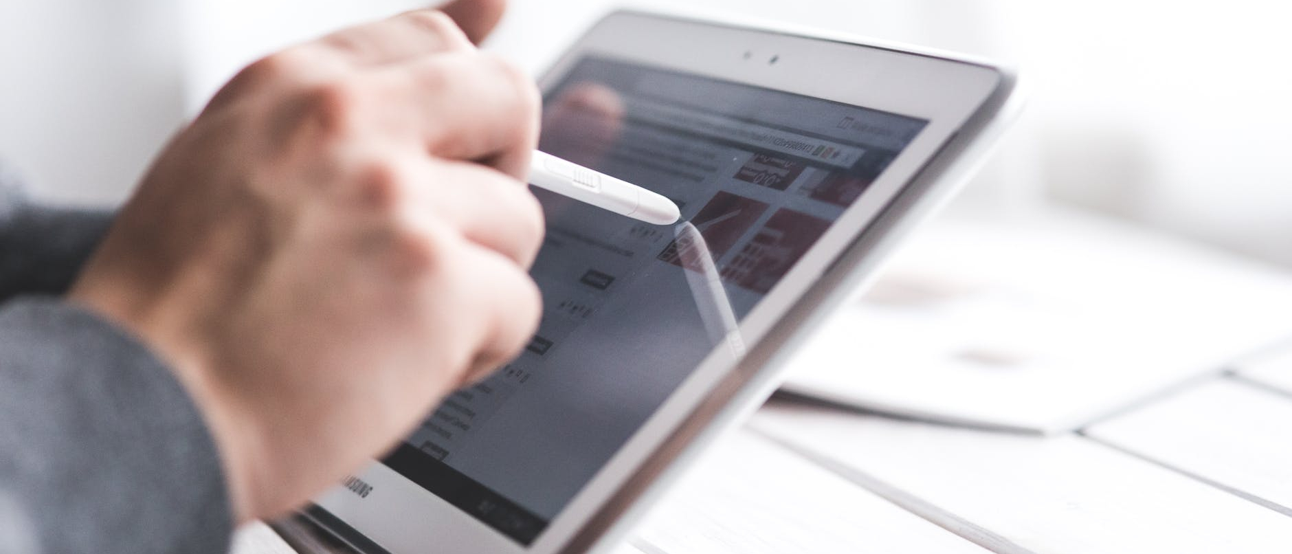 Man creating a digital marketing strategy on a tablet