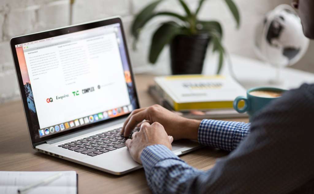 man working from home on a laptop