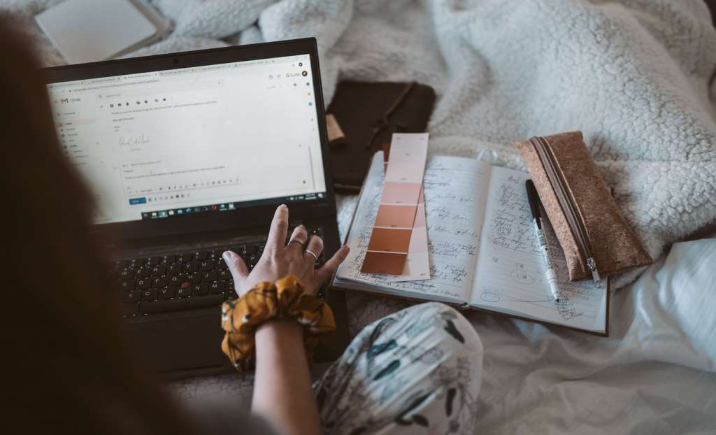 Woman using laptop for the tools for email marketing automation