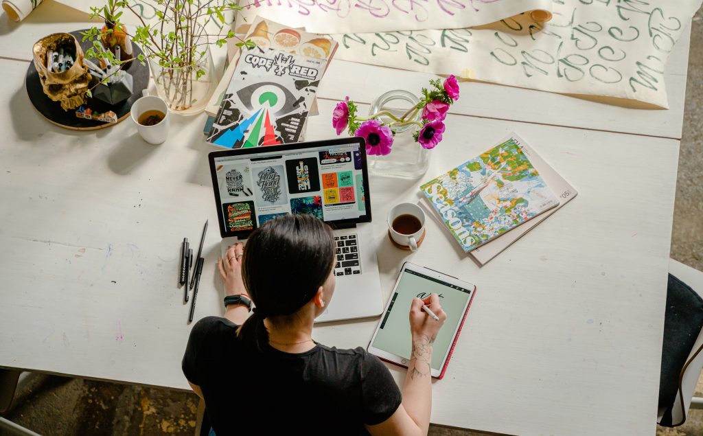 woman working on laptop with video marketing tools
