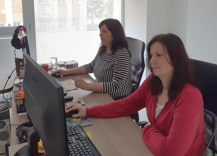 Daniela and her colleague Janet working on social media marketing