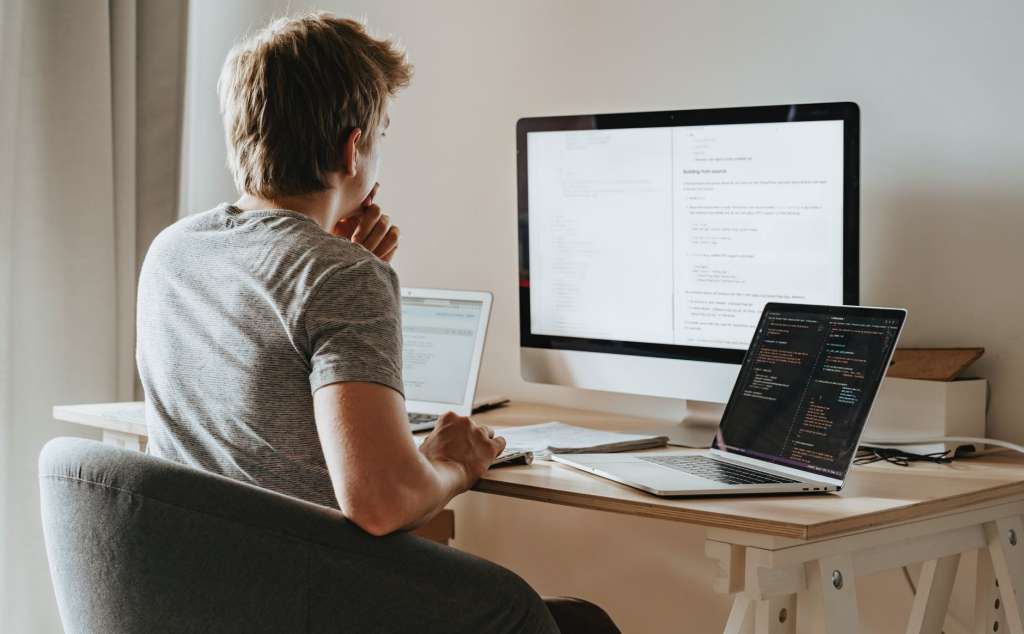 Man programming and managing a project